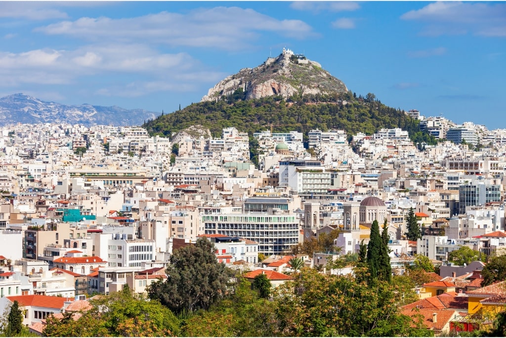 Athens: A Comprehensive Tour Guide Athens, the capital of Greece, is a city steeped in history and culture, known for its ancient landmarks, vibrant neighborhoods, and rich traditions. This guide aims to provide you with an overview of Athens, from its historical significance to modern-day attractions, ensuring you have an enriching experience. Introduction Athens is often referred to as the cradle of Western civilization and the birthplace of democracy. With a history spanning over 3,400 years, it is one of the world's oldest cities. The city's name is derived from Athena, the goddess of wisdom and war, who was revered by the ancient Greeks. Today, Athens is a bustling metropolis, blending the ancient with the modern, making it a unique destination for travelers. Historical Background Ancient Athens 1. The Golden Age (5th Century BC): This era marked the peak of Athenian power and cultural achievement. Under the leadership of Pericles, Athens flourished in arts, philosophy, and democracy. The construction of iconic structures like the Parthenon began during this time. 2. Philosophy and Arts: Athens was home to great philosophers such as Socrates, Plato, and Aristotle. The city became a center for arts and theater, with playwrights like Sophocles and Euripides creating timeless works. 3. The Roman Era: After being conquered by the Romans in 146 BC, Athens retained its cultural significance. The Romans admired Greek art and philosophy, leading to the continued flourishing of Athenian culture. Modern Athens 1. 19th Century: Athens was declared the capital of Greece in 1834. Significant efforts were made to restore ancient monuments and build new structures that reflect the city’s historical heritage. 2. 20th Century to Present: The city has faced various challenges, including World War II and economic crises. However, it has continuously evolved and modernized, becoming a vital cultural and economic hub in Europe. Major Attractions 1. The Acropolis The Acropolis is undoubtedly the crown jewel of Athens. This ancient citadel overlooks the city and is home to several significant structures, including: • The Parthenon: Dedicated to Athena, this temple is an architectural marvel and a symbol of ancient Greece. Its Doric columns and exquisite sculptures showcase the height of classical art. • The Erechtheion: Known for its Caryatids, the Erechtheion was a temple dedicated to Athena and Poseidon. The building’s asymmetrical design reflects the uneven terrain of the Acropolis. • The Temple of Athena Nike: This small temple, dedicated to the goddesses of victory, is famous for its elegant Ionic design and friezes depicting historical battles. 2. The Acropolis Museum Located at the foot of the Acropolis, the Acropolis Museum is a modern architectural masterpiece. It houses a vast collection of artifacts from the Acropolis, including sculptures, pottery, and everyday items from ancient Athens. The museum's glass floors provide a glimpse of the archaeological site beneath, enhancing the visitor experience. 3. The Ancient Agora The Ancient Agora was the heart of public life in ancient Athens. Visitors can explore its ruins, including the Temple of Hephaestus, one of the best-preserved temples from ancient Greece. The site also features the Stoa of Attalos, which has been reconstructed and serves as a museum showcasing artifacts from the Agora. 4. Plaka and Monastiraki Plaka is the historic neighborhood of Athens, characterized by its narrow streets, neoclassical architecture, and vibrant atmosphere. Here, you can find numerous tavernas, shops, and cafes. Monastiraki is famous for its flea market, where visitors can hunt for unique souvenirs, antiques, and local crafts. The square is also home to the impressive Tzistarakis Mosque and the Ancient Agora. 5. Syntagma Square Syntagma Square is the central square of Athens and a significant hub for political and social events. The square is home to the Greek Parliament building, where you can witness the Changing of the Guard ceremony at the Tomb of the Unknown Soldier. This colorful ceremony features the Evzones, the traditional Greek guards, dressed in their distinctive uniforms. 6. National Archaeological Museum This museum is one of the most important archaeological museums in the world, showcasing artifacts from various periods of Greek history. Highlights include the Mask of Agamemnon, ancient sculptures, and a vast collection of pottery and jewelry. 7. Mount Lycabettus For breathtaking panoramic views of Athens, a hike or a funicular ride up Mount Lycabettus is a must. At the summit, visitors can enjoy stunning vistas of the Acropolis, the Aegean Sea, and the sprawling city below. There is also a charming chapel, Agios Georgios, and a restaurant at the top. 8. Temple of Olympian Zeus Once one of the largest temples in the ancient world, the Temple of Olympian Zeus took over 600 years to complete. Today, only a few columns remain standing, but the site is still impressive and offers insight into the grandeur of ancient Greek architecture. Culture and Cuisine Greek Culture Athens is a melting pot of cultures, with influences from its rich history, modern art, and vibrant lifestyle. The city hosts various cultural events, including music festivals, art exhibitions, and theatrical performances. The annual Athens Epidaurus Festival showcases ancient Greek plays and modern performances in historical venues. Traditional Cuisine Greek cuisine is famous for its flavors and use of fresh ingredients. When in Athens, be sure to try: • Moussaka: A layered dish made with eggplant, minced meat, and béchamel sauce. • Souvlaki: Grilled meat skewers, often served with pita and tzatziki sauce. • Dolmades: Grape leaves stuffed with rice, herbs, and occasionally meat. • Baklava: A sweet pastry made with layers of filo dough, nuts, and honey syrup. Local tavernas and street vendors offer authentic culinary experiences that allow visitors to indulge in traditional Greek dishes. Practical Information for Travelers Getting There Athens International Airport (Eleftherios Venizelos) is well-connected to major cities around the world. From the airport, you can reach the city center via metro, bus, or taxi. Transportation • Metro: The Athens Metro is an efficient and affordable way to get around the city. It connects major attractions and neighborhoods. • Buses and Taxis: Public buses cover areas not served by the metro. Taxis are also available, but it's advisable to confirm the fare before starting your journey. • Walking: Many of Athens' attractions are within walking distance of each other, especially in the historical center. Best Time to Visit The best times to visit Athens are during the spring (April to June) and fall (September to November) when the weather is pleasant, and tourist crowds are smaller. Summer can be hot, making sightseeing less enjoyable, but it’s also when many cultural events take place. Safety Tips Athens is generally safe for tourists, but it's wise to take standard precautions: • Keep an eye on your belongings in crowded areas. • Avoid poorly lit streets at night. • Be cautious of scams targeting tourists. Language and Communication The official language is Greek, but English is widely spoken, especially in tourist areas. Learning a few basic Greek phrases can enhance your experience and interactions with locals. Currency and Payments The currency used in Greece is the Euro (€). Credit cards are widely accepted, but it’s a good idea to carry some cash, especially for small purchases and in local markets. Conclusion Athens is a city where ancient history meets modern life. From its breathtaking archaeological sites to its vibrant neighborhoods, there’s no shortage of experiences to be had. Whether you’re exploring the ruins of the Acropolis, savoring traditional Greek cuisine, or wandering through bustling markets, Athens promises an unforgettable journey through time and culture. With its rich heritage and lively atmosphere, Athens is a destination that will leave a lasting impression on every traveler. ________________________________________ This guide serves as a starting point for exploring Athens, ensuring you have a comprehensive understanding of what this remarkable city has to offer. Enjoy your trip!