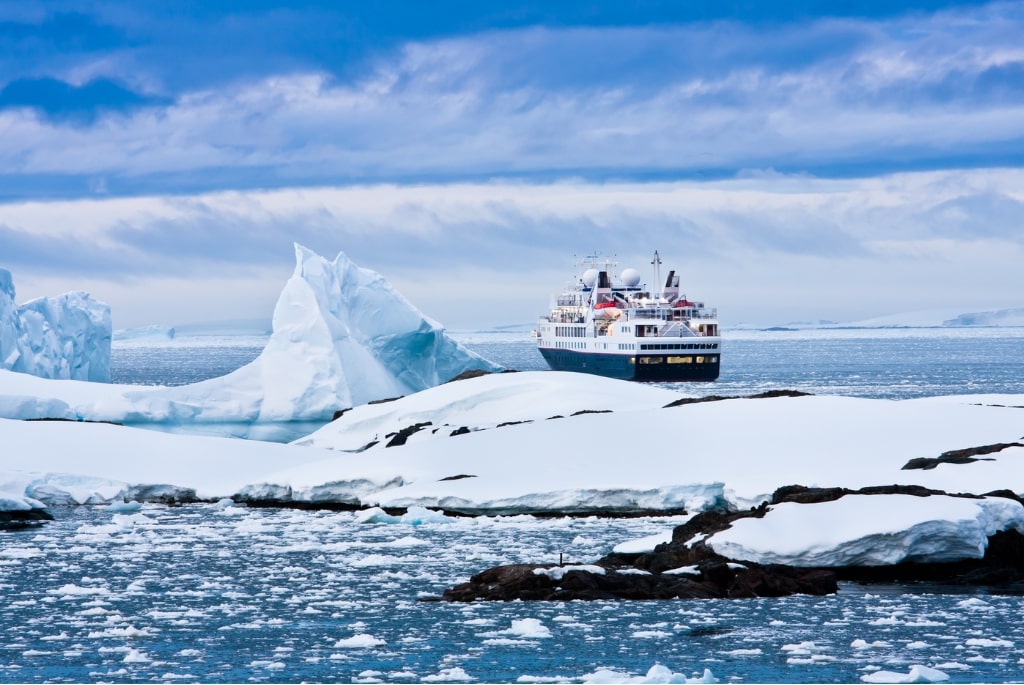 Comprehensive Tour Guide to Antarctica Introduction Antarctica, the southernmost continent, is renowned for its stark beauty, unique wildlife, and pristine landscapes. As the coldest, windiest, and driest continent, it presents a destination like no other for adventurers and nature enthusiasts alike. This guide provides a detailed overview of traveling to Antarctica, covering essential information, itineraries, wildlife, safety, and environmental considerations. 1. Planning Your Trip 1.1 Best Time to Visit The Antarctic travel season runs from late October to early March, coinciding with the Southern Hemisphere’s summer. During this period, temperatures are milder, and wildlife is more active. • October-November: Spring season, with ice melting and penguins nesting. • December-January: Warmest months; perfect for wildlife viewing and longer daylight hours. • February-March: Late summer; ideal for whale watching and seeing penguin chicks. 1.2 Travel Options Traveling to Antarctica typically involves a cruise or guided expedition. Most travelers depart from Ushuaia, Argentina, the southernmost city in the world. • Cruise Ships: Offer varying levels of luxury and comfort, from budget options to luxury liners. • Expedition Ships: Smaller vessels that allow for more intimate exploration and landings. 1.3 Cost Expect to spend between $5,000 and $15,000 per person, depending on the cruise type, length of stay, and onboard amenities. Costs typically include accommodation, meals, and guided tours. 2. Getting There 2.1 Flight to Ushuaia Most trips begin with a flight to Ushuaia. Several airlines connect major cities like Buenos Aires and Santiago to Ushuaia. 2.2 Crossing the Drake Passage Travelers must cross the Drake Passage to reach Antarctica. This stretch of water can be turbulent, but it is a vital route for accessing the continent. 3. Itineraries and Destinations Antarctic itineraries can vary significantly. Here’s a sample itinerary to give an idea of what to expect. Day 1-2: Departure from Ushuaia • Boarding the ship and orientation. • Sail through the Beagle Channel and into the Drake Passage. Day 3-4: Drake Passage • Experience the stunning scenery while at sea. • Attend lectures and presentations about Antarctica’s ecology and history. Day 5-8: Antarctic Peninsula • Land on various islands and sites, including: o Deception Island: A volcanic caldera with hot springs and a historical whaling station. o Half Moon Island: Home to a Gentoo penguin colony. o Lemaire Channel: Known for its breathtaking scenery and wildlife sightings. o Port Lockroy: A former British research station and now a museum. Day 9-10: South Shetland Islands • Visit islands such as: o King George Island: Home to research bases and diverse wildlife. o Livingston Island: Famous for its diverse landscapes and seal populations. Day 11-12: Return Journey • Retrace your path through the Drake Passage, with additional talks and opportunities to observe seabirds and marine life. 4. Wildlife Encounters Antarctica is teeming with unique wildlife, making it a prime destination for animal lovers. 4.1 Penguins • Emperor Penguins: The largest species, found primarily on the sea ice. • Adélie Penguins: Smaller and found along the entire Antarctic coast. • Gentoo Penguins: Known for their bright orange beaks and distinctive white stripe on their heads. 4.2 Seals • Weddell Seals: Often found lounging on ice and known for their ability to dive deep. • Leopard Seals: Recognizable by their spotted coats and predatory nature. • Crabeater Seals: Named for their primary diet of krill. 4.3 Whales Common species include: • Humpback Whales: Known for their acrobatics and songs. • Orcas: Often seen hunting in pods. • Blue Whales: The largest animal on Earth, occasionally spotted. 4.4 Birds • Albatrosses: Majestic seabirds known for their large wingspans. • Petrels: Often seen gliding effortlessly over the waves. 5. Activities and Excursions While onboard, guests can partake in various activities designed to enhance their experience. 5.1 Zodiac Excursions These inflatable boats allow for close-up views of icebergs, seals, and penguins while navigating through the ice. 5.2 Kayaking Guided kayaking excursions offer a unique perspective of the landscape and wildlife. 5.3 Camping Some tours offer overnight camping on the ice for an immersive experience. 5.4 Photography Workshops For photography enthusiasts, onboard workshops and guided excursions can help capture stunning images of the landscape and wildlife. 6. Safety Considerations 6.1 Health Precautions • Medical Facilities: Ships are equipped with basic medical facilities, but it’s wise to carry personal medications. • Travel Insurance: Essential for covering potential medical emergencies and trip cancellations. 6.2 Environmental Safety • Leave No Trace: Adhere to strict environmental guidelines to minimize human impact. • Wildlife Interaction: Maintain a respectful distance from wildlife; do not feed or touch animals. 7. Environmental Responsibility Antarctica is a fragile ecosystem, and responsible tourism is essential to preserving its beauty. 7.1 Guidelines for Visitors • Follow the International Association of Antarctica Tour Operators (IAATO) guidelines. • Stick to designated paths and respect wildlife. 7.2 Climate Change Awareness • Understand the impacts of climate change on polar regions and engage in discussions about conservation efforts. 8. Cultural Insights 8.1 Research Stations • Antarctica is home to numerous research stations operated by different countries. While visiting, learn about the scientific work being done to study climate change and wildlife. 8.2 Historical Context • Explore the rich history of exploration, including the stories of famous explorers like Ernest Shackleton and Robert Falcon Scott. Conclusion A journey to Antarctica is an unforgettable adventure, offering stunning landscapes, unique wildlife, and the chance to explore one of the most remote places on Earth. Proper planning, respect for the environment, and a spirit of adventure will ensure a fulfilling experience in this majestic, icy wilderness. Whether you're cruising through icy waters, observing wildlife, or simply taking in the breathtaking scenery, Antarctica promises to leave a lasting impression. Additional Resources • Books: "Endurance: Shackleton's Incredible Voyage" by Alfred Lansing and "Antarctica: An Intimate Portrait of a Mysterious Continent" by G. J. K. Irwin. • Websites: IAATO for guidelines and safety tips, and expedition cruise companies for itinerary options. Final Tips • Be prepared for changing weather conditions. • Pack appropriately: layers, waterproof clothing, and sturdy footwear. • Embrace the experience; take time to soak in the natural beauty around you. This guide aims to equip you with essential knowledge for your Antarctic adventure, ensuring you’re well-prepared for an awe-inspiring journey to the end of the Earth.